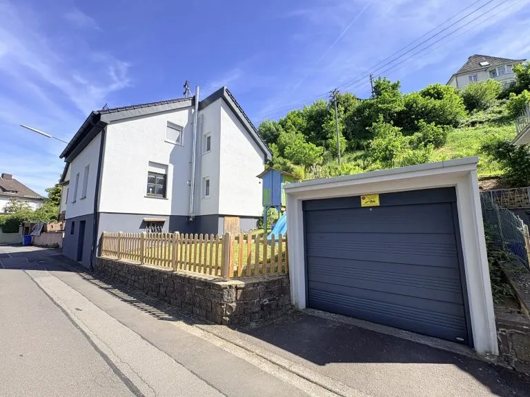 Immobilienangebot - Wissen - Alle - Modernisiertes Einfamilienhaus mit Garten und Garage in guter Zentrumslage!