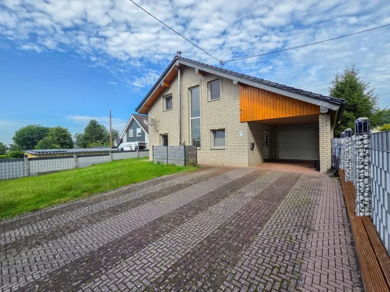 Immobilienangebot - Wölmersen - Alle - *RESERVIERT* Verklinkertes Einfamilienhaus mit Wintergarten, Garage und Garten in ruhiger Wohnlage!